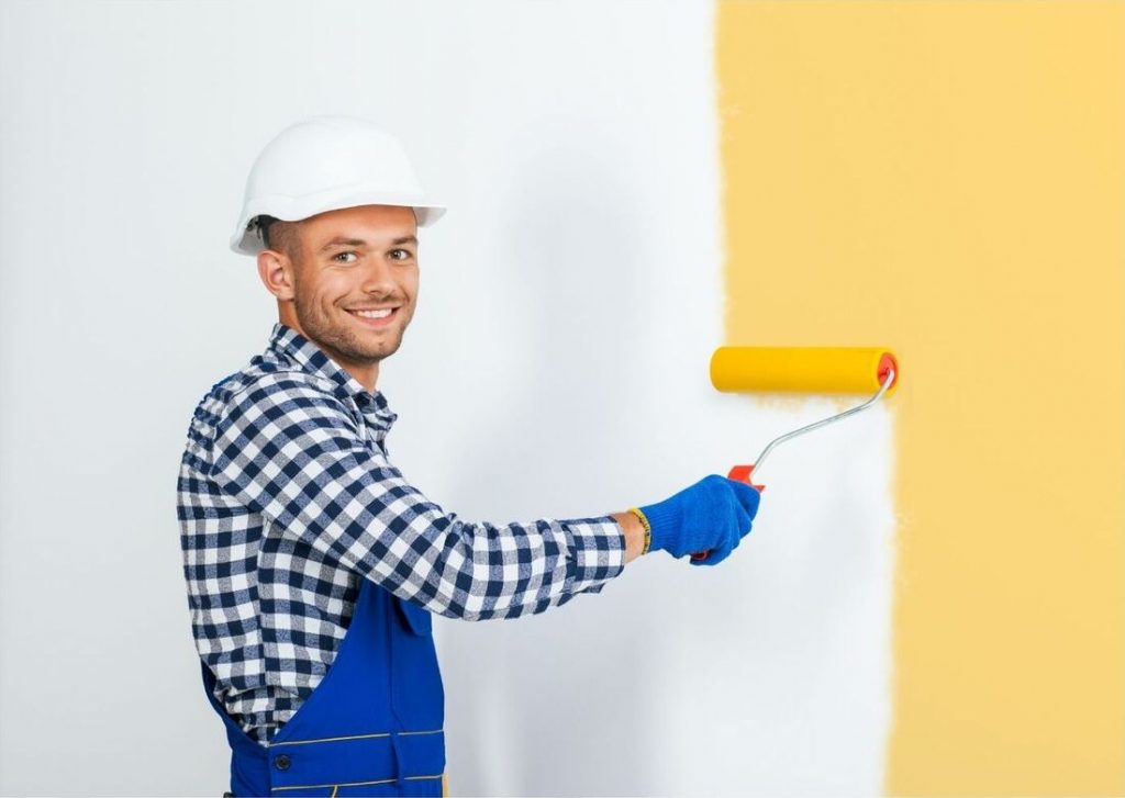 boy painting a wall